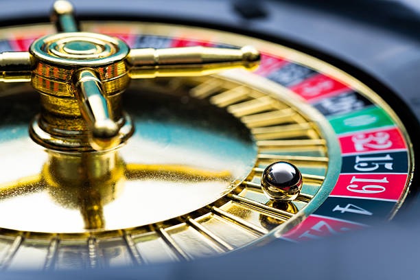 Live dealer revealing card from deck in Mega Sevens round